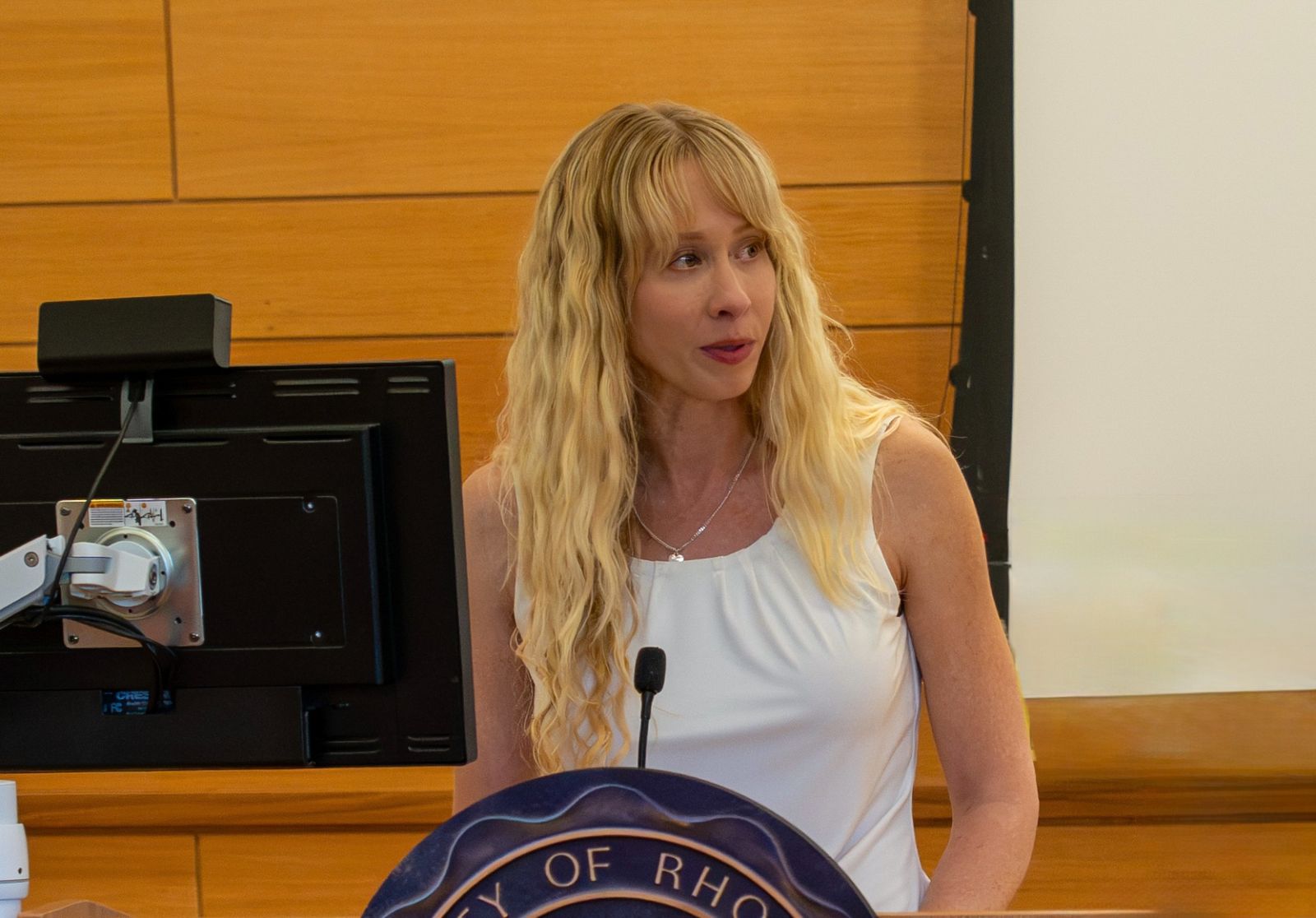 Ashlea Rundlett speaking at a lectern.